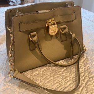 Michael kors bag with a locket  very elegant